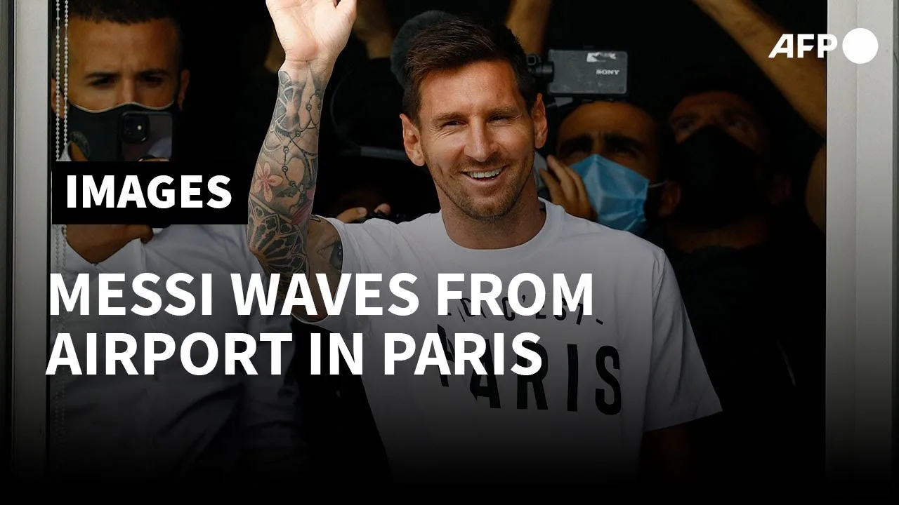 Football: Lionel Messi waves from airport window upon